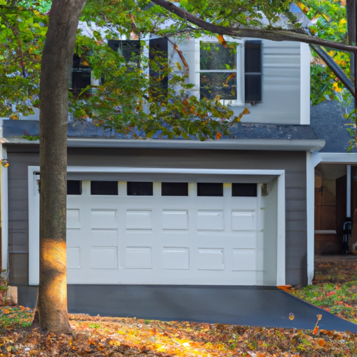 Suburban Wyckoff home with a visible residential garage door and opener rail, late-afternoon light, no people.