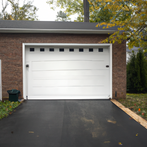 Residential garage door on a brick Wyckoff, NJ home with visible tracks and weatherstripping, late afternoon light.